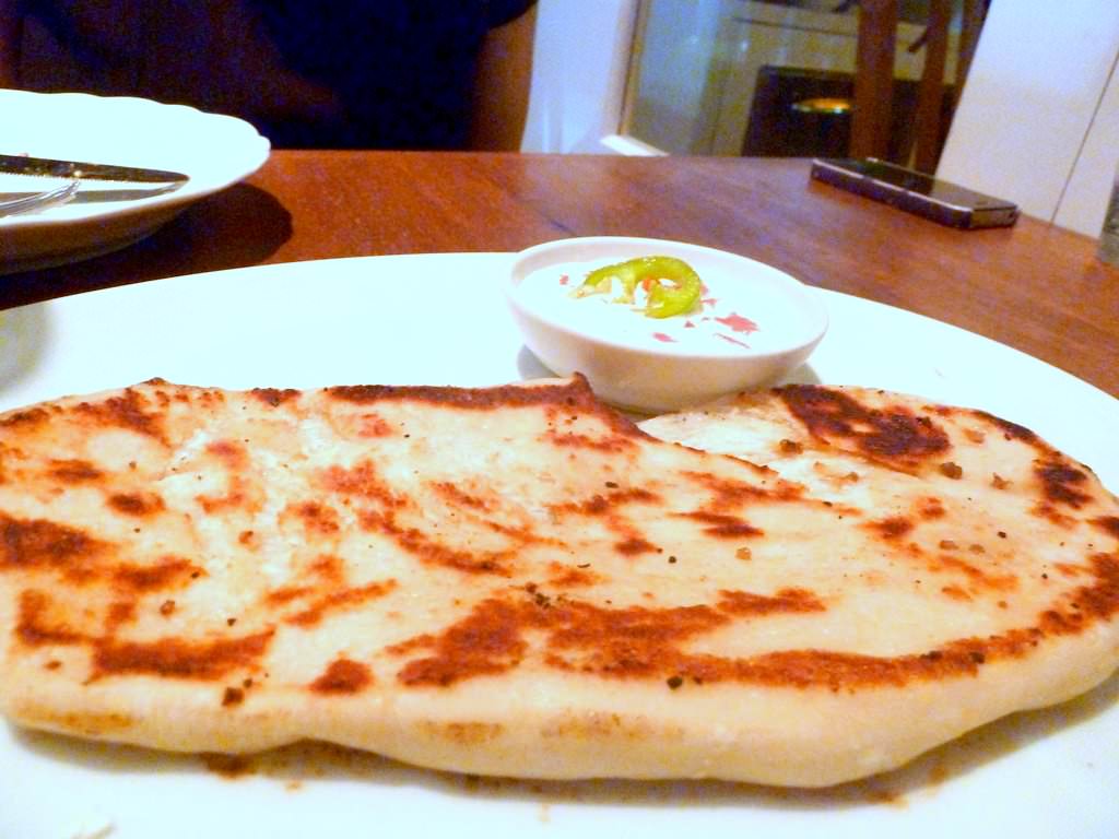 P1200858.JPG Carb (11 NIS), was a small bread pan baked, something between Indian Naan and Italian Focaccia. Came with a side of creme fraiche with tomatoes. A weird side but a nice bread.