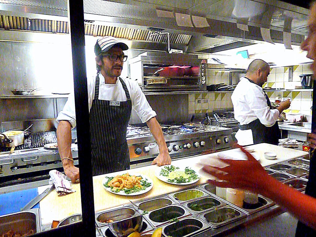 P1200859.JPG The hot kitchen is not part of the dinning room but is still open kitchen for the customers to take a peek.