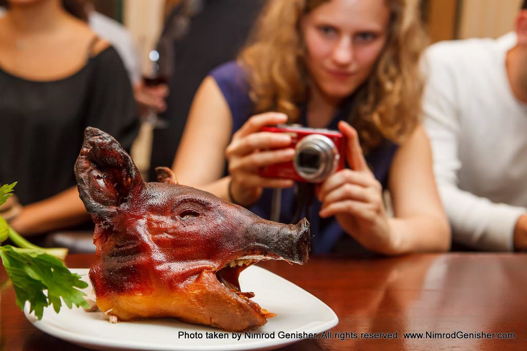 Whole piglet marinated in Calvados, honey and apples.