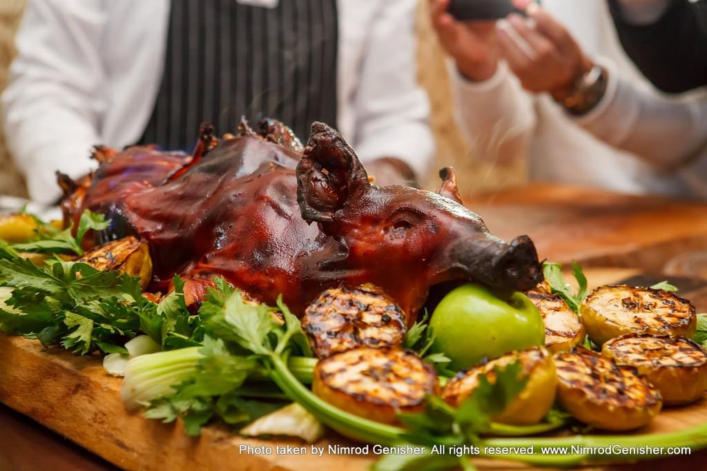 Whole piglet marinated in Calvados, honey and apples.