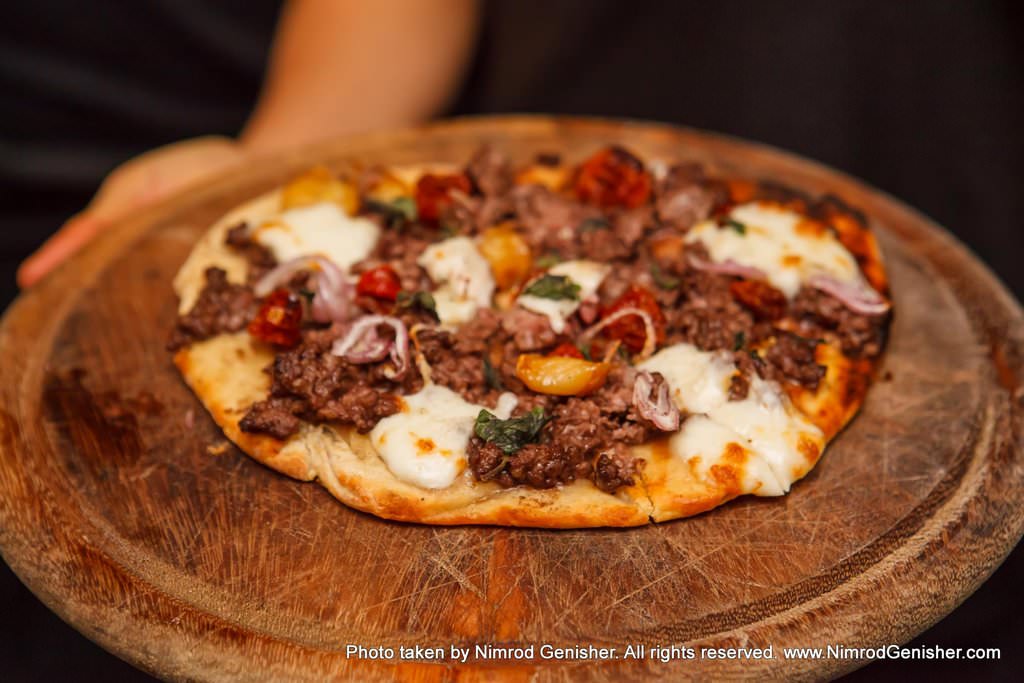 NG's "Pizza", Flatbread with grilled Entrecote chopped on top, Solog cheese, tomatoes, raisins, shallots, garlic confit, oregano and some fresh chilli.