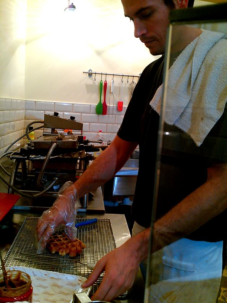 A chocolate stick inserted into the waffle in what seem to be a medical operation.