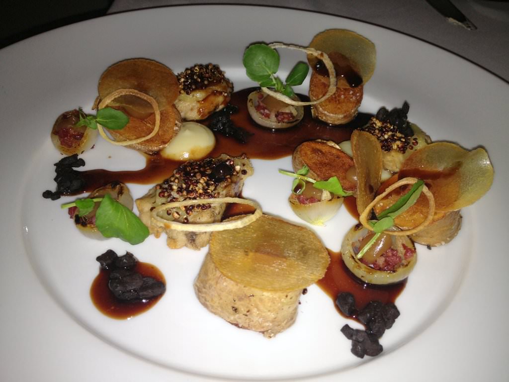 Veal marrow "Sofrito", sage butter, garlic confit, crispy quinoa seeds in spices, Ratte fries, garlic cream, variations of onion, lamb pancetta, red wine and juniper sauce (97 NIS).