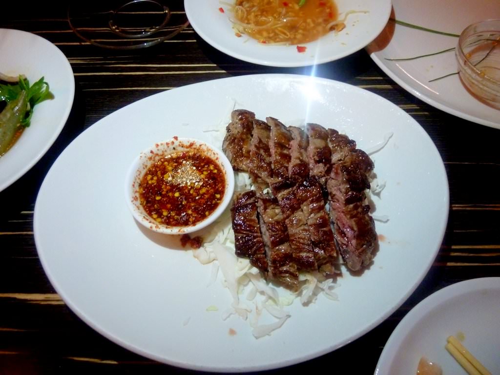 Sliced Roasted Beef "NEUA YANG" , Roughly sliced Roasted Beef served with traditional hot sauce (46 NIS). Excellent way to eat a steak. The sauce was a great match, the meat tender and red in the center. Simple but successful dish.