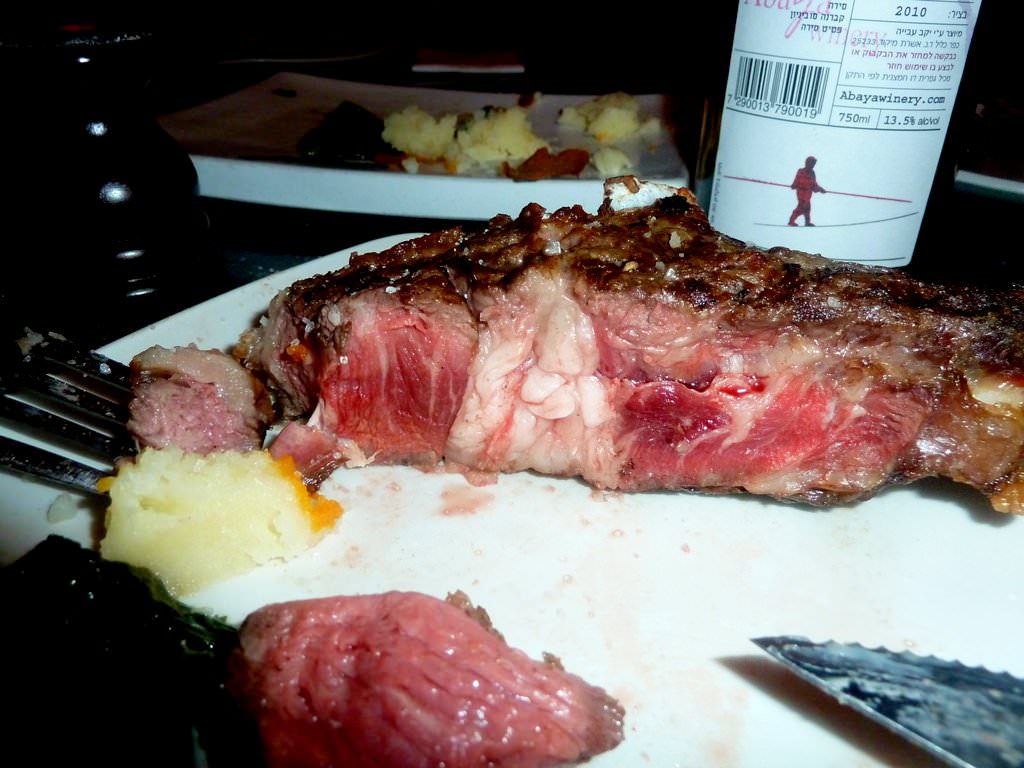 Prime Rib, aged and juicy Entrecote on the bone from a senior cow.