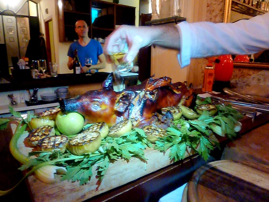 Whole piglet marinated in Calvados, honey and apples.