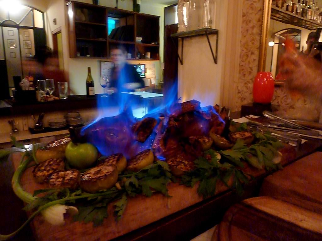 Whole piglet marinated in Calvados, honey and apples.
