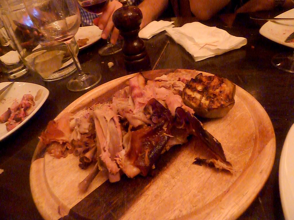 Whole piglet marinated in Calvados, honey and apples.