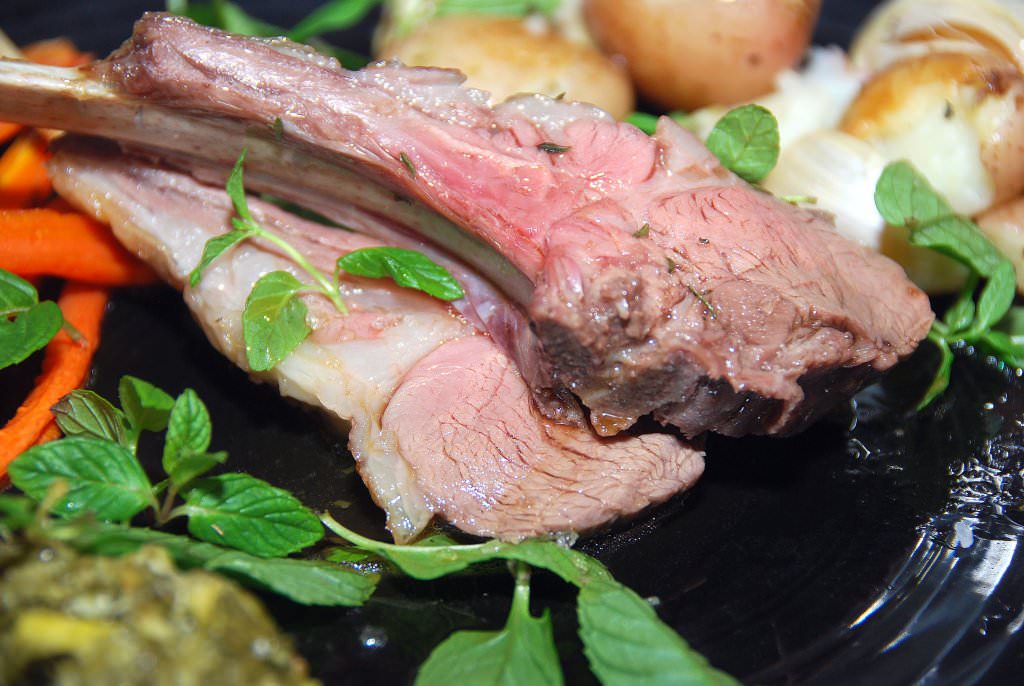 Lamb ribs, mint and chili chimichurri, baked Potatoes, garlic and honey roasted carrots