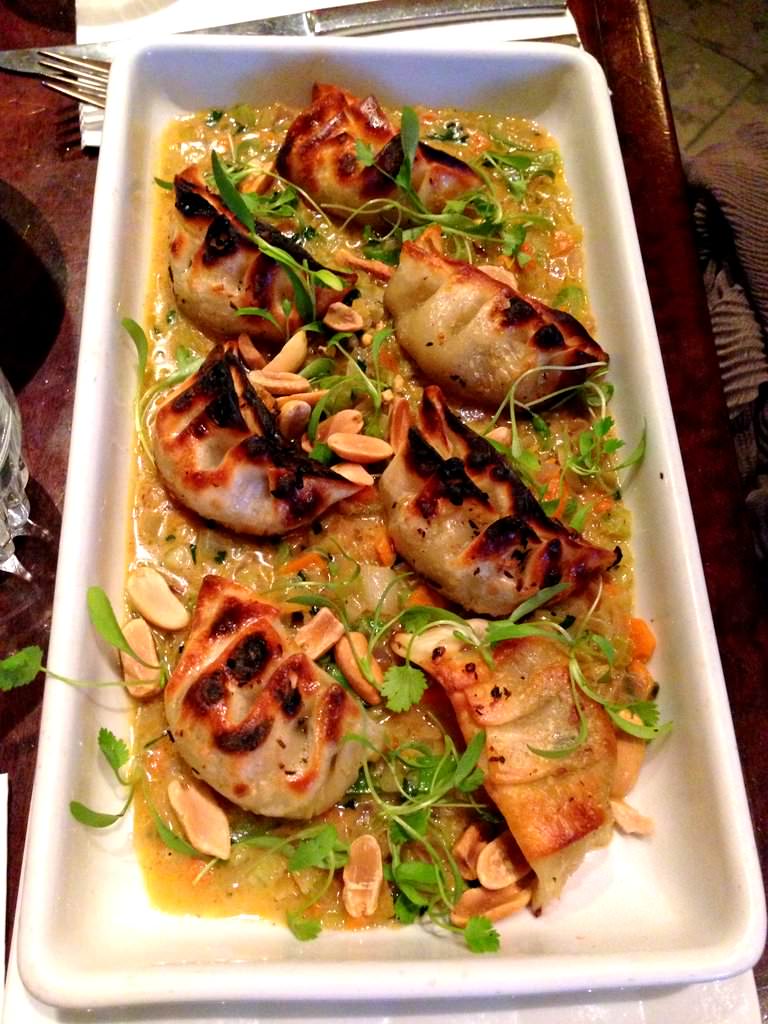 Shrimp dumplings cooked in coconut milk, root vegetables, mild curry, herbs and peanuts (74 NIS for the meal).