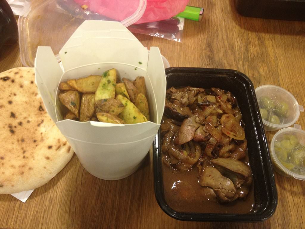 Grilled chicken livers with onions seasoned with soy and honey accompanied by fries garlic bread and pickles (39 NIS).