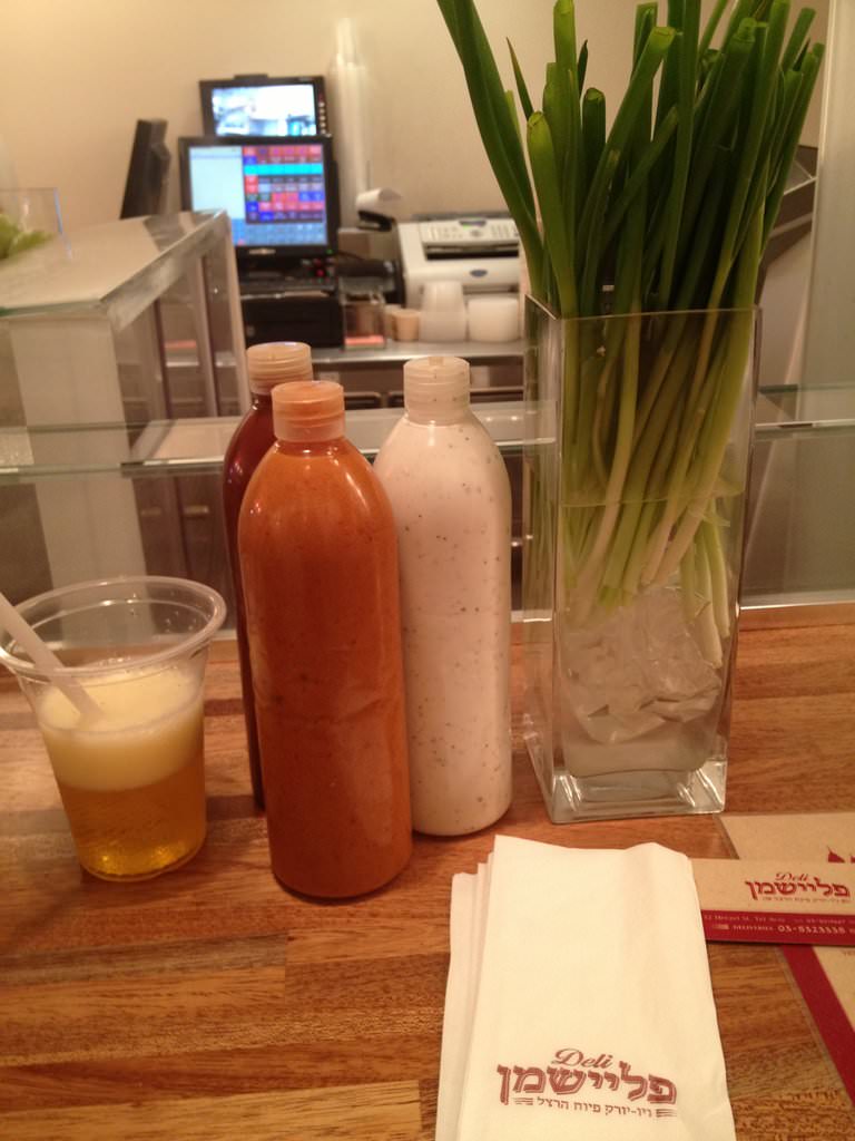Spring onions in a vase and free refill sodas in Fleishman Deli
