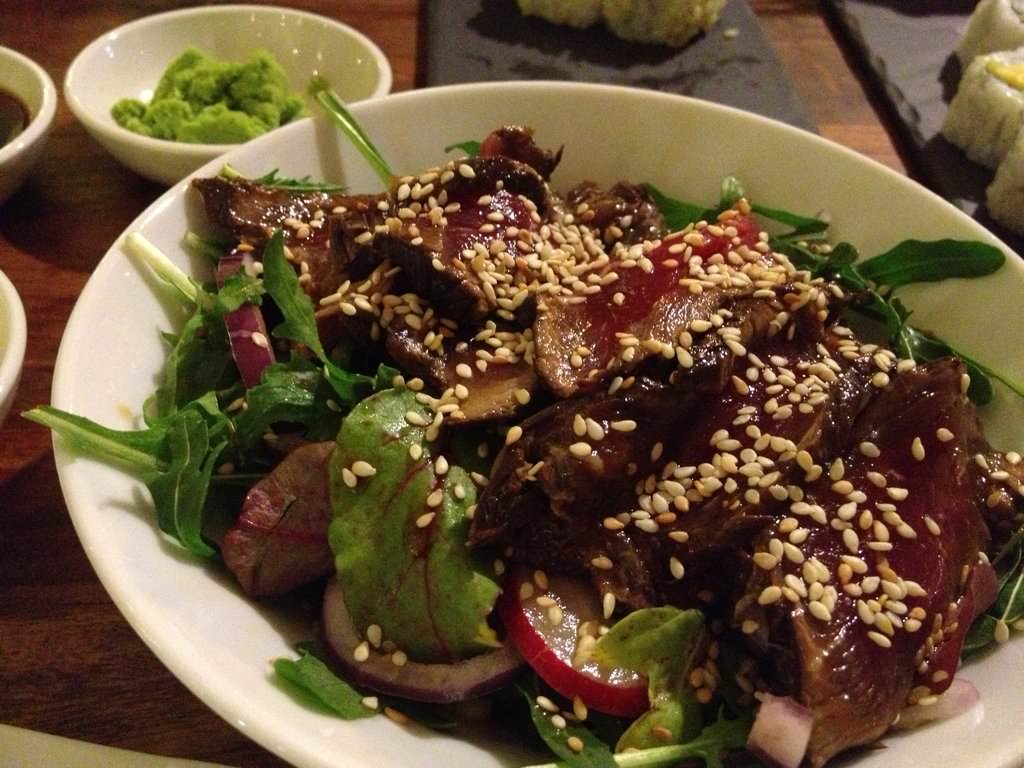 Tataki salad of seared sirloin, baby leaves, radish, red onion and ponzo citrus sauce.