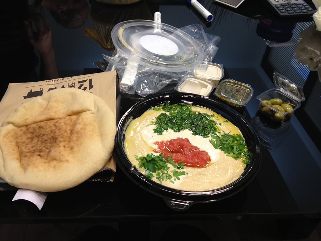 The "Brother's Hummus" with red salsa, Tahini and two pitas (22 ILS).