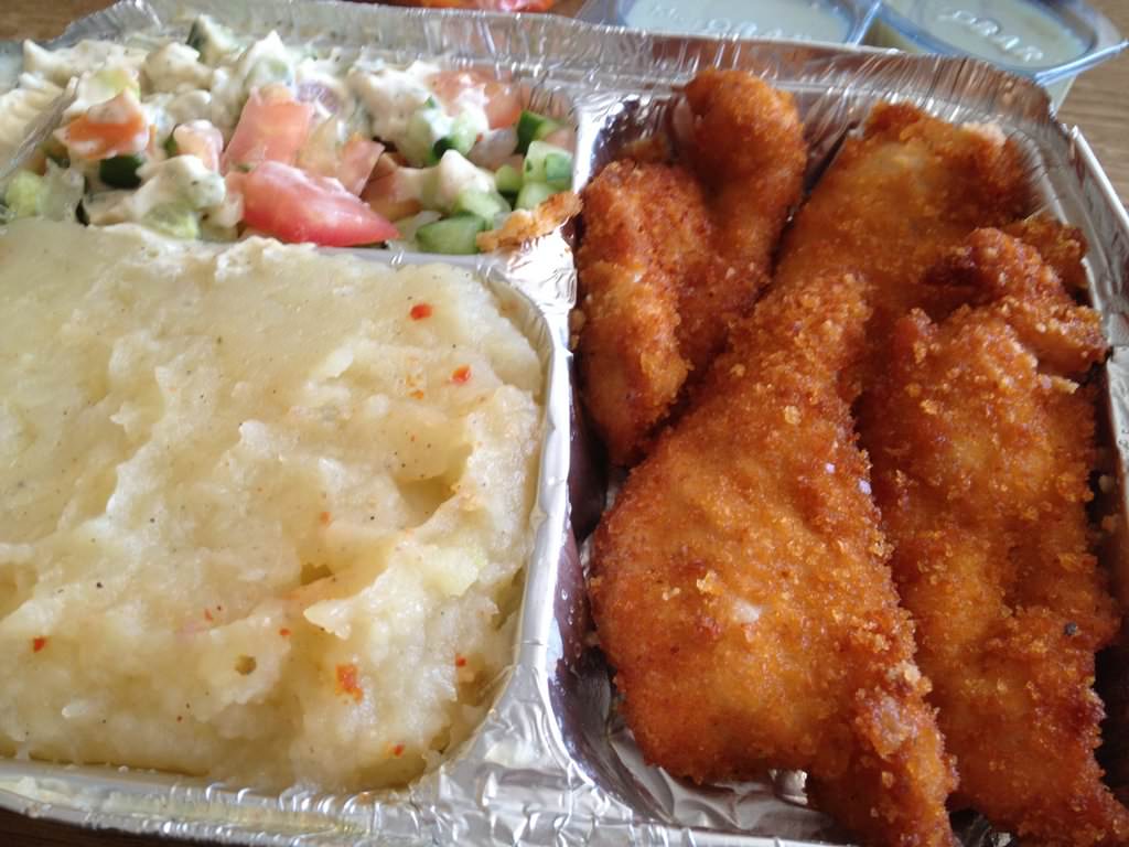 "Greek Garlic Shnizel" with salad and tahini, mashed potatoes and condiments honey mustard and garlic mayo (30 ILS).