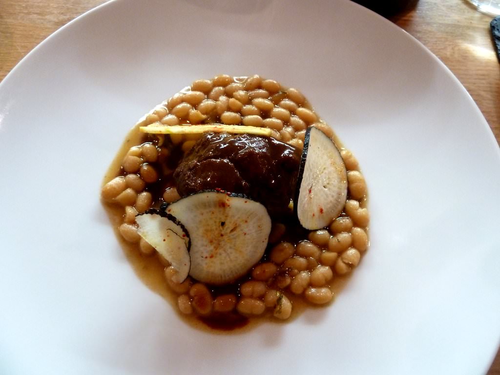 Braised pork cheek, cooked beans and black radish with red wine and miso sauce.