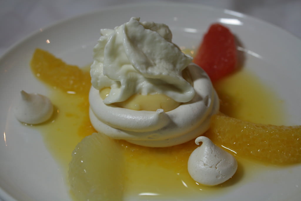 Citrus Pavlova: meringue basket, mandarin,soup, Lemon curd, white chocolate mousse, orange and grapefruit filet.